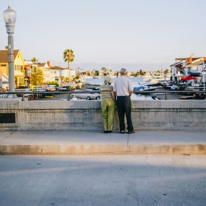 Elderly couple enjoying the view from a bridge