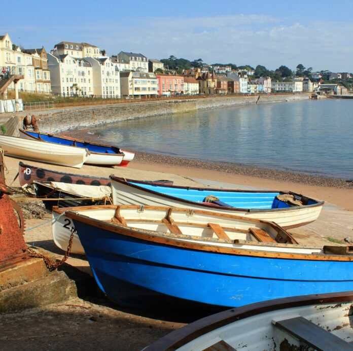 Boats on the beach in Dawlish, Devon, England, UK