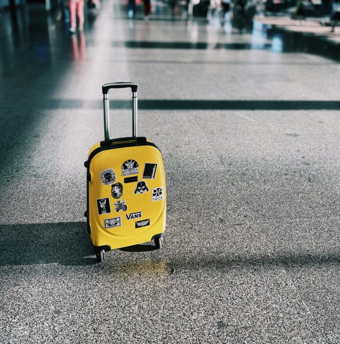 Yellow suitcase abandoned at the airport terminal