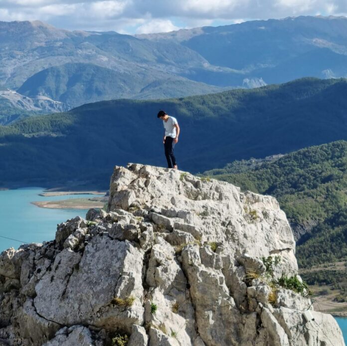 Man on Rock Formation Near Lake Bovilla in Tirana, Tirana County, Albania