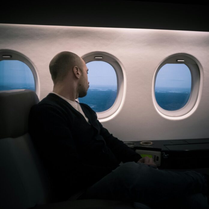 Man sitting on an airplane seat