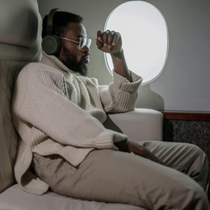 Man Sitting Near the Airplane Window